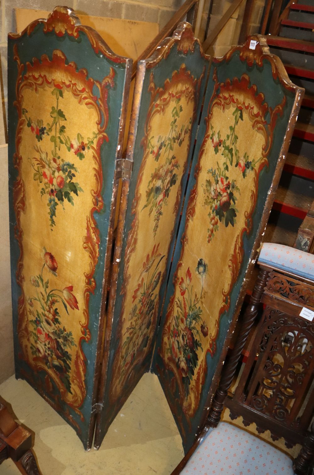 A three fold screen with floral decoupage panels, on bracket feet, 147 x 155cm